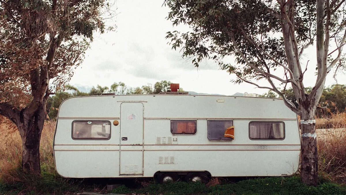 Touring caravan standing under trees on a paddock outside Amersham