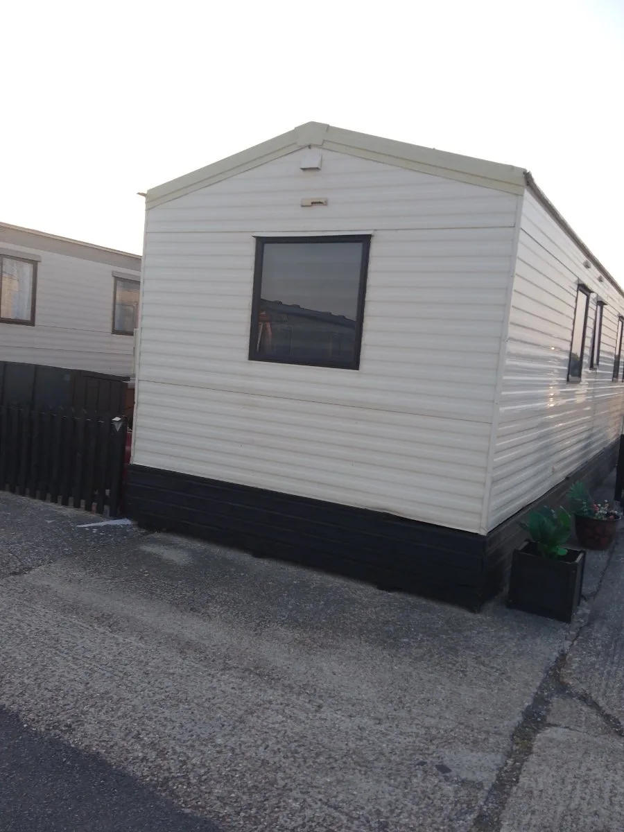 Static caravan standing tight against its neighbour, the kind of restricted access checked from photos before a Basingstoke quote is confirmed